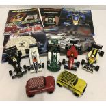 7 unboxed vintage Scalextric cars with 5 catalogues.