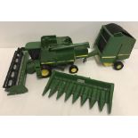 A large diecast and plastic John Deere Combine Harvester and Bailer made by Ertl.