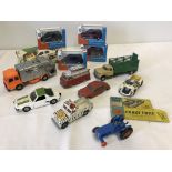 A box of boxed & unboxed Corgi cars.