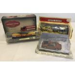 A collection of boxed die cast vehicles.
