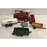 5 Britains models comprising; Combine Harvester and 4 trailing implements.