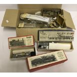 A quantity of white metal model railway kits and parts.