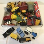 A box of mixed die cast vehicles and farm machinery.