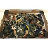 A box of plastic toy soldiers , cowboys, Indians and sci fi figures.