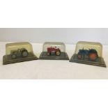 3 boxed diecast tractor models.