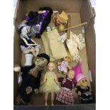 A collection of dolls and puppets.