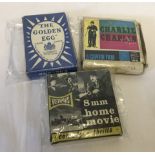 2 boxed vintage 8mm black and white films together with a Chad Valley Golden Egg card game.