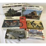 4 boxed part made plastic kits together with a boxed Airfix 1:32 scale German Infantry.