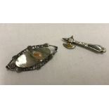 2 vintage silver brooches.