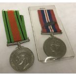 WWII pair comprising Defence medal and 1939-1945 War medal with oakleaf clasp.