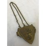 19th century pattern brass cross belt shield shaped badge with grenade pattern and chain.