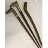 3 vintage walking canes to include 2 with brass animal head handles.