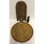 A carved yew wood fruit platter. Together with a tribal mask and figurine.