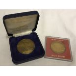 2 cased solid bronze commemorative medallions.