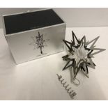 A boxed Georg Jensen contempory design christmas tree north star topper.