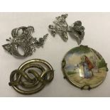 A collection of 4 vintage brooches.