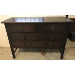 A vintage 4 drawer dark oak 2 over 2 chest.