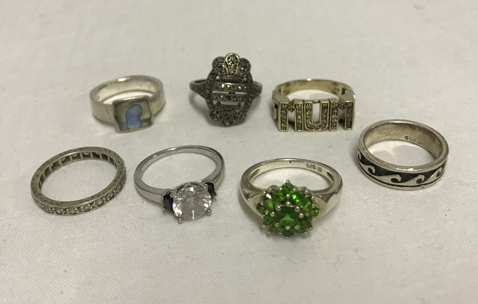 A collection of 7 ladies silver rings. Some stone set.