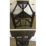 An early 20th century Arts & Crafts dark oak 'Turner's Chair'.