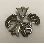 A Silver Geoffrey Bellamy design for Ivan Tarrant fern and flowers brooch.