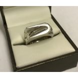 A contempory design silver ring.