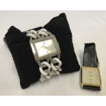 A ladies Guess watch with silver tone & white chain bracelet.