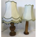 2 vintage wooden based table lamps with light shades.