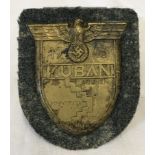German WWII pattern 1943 Kuban metal badge on uniform cloth.