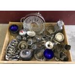 A large tray of assorted silver plate items.