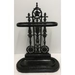 A vintage cast iron stick stand.