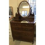 An Edwardian Mahogany 2 over 3 chest of drawers with mirrored back.