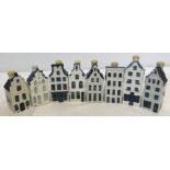A collection of 8 Blue Delft KLM BOLS ceramic miniature houses.