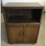 Vintage 2 door cabinet with shelf and carved detail to front.