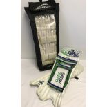 A pair of Gunn & Moore cricket leg guards together with a pair of Slazenger leg guards in carry bag.