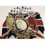 A collection of Royal commemorative medals and 1953 coronation scarf.
