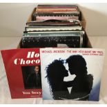 2 boxes of mostly 1980's vinyl 12" and LP's.