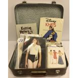 A suitcase of vintage knitting and dressmaking patterns.