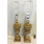 A pair of vintage marble lamp bases together with a pair of cream and gold lampshades.