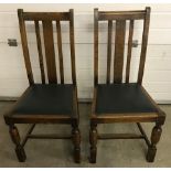 A pair of vintage dark oak high back dining chairs. With turned detail to front legs.