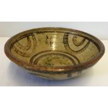 A large Winchcombe Pottery bowl by Michael Cardew dated between 1926 - 1939.