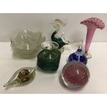 A small collection of coloured glassware to include paperweights.