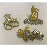 3 misc military silver and gilt coloured officers cap badges.