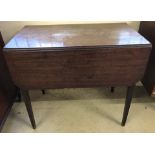 An early Georgian dark wood drop leaf occasional table on tapered legs.