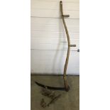 A vintage scythe and assorted woodworking tools