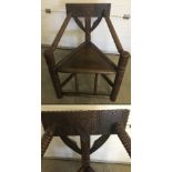 An early 20th century Arts & Crafts mid oak 'Turner's Chair'.