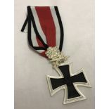 A reproduction WWII Knights cross with oak leaves and crystal "diamonds".