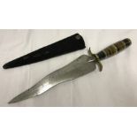 A serpentine bladed dagger with banded onyx and brass handle set with coin pommel.