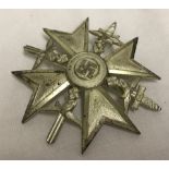 A reproduction WWII German Spanish cross in "Silver".