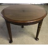 Small mahogany circular coffee table with cabriole legs.