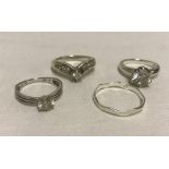 4 ladies silver dress rings.